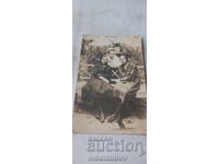Photo Youth and two young girls on a wooden bench 1923