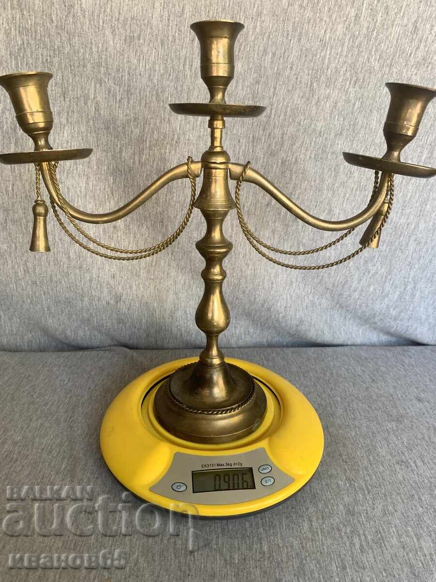 Delivery of Brass candlestick with decorative ropes and tassels Delivery of Brass candlestick with decorative ropes and tassels