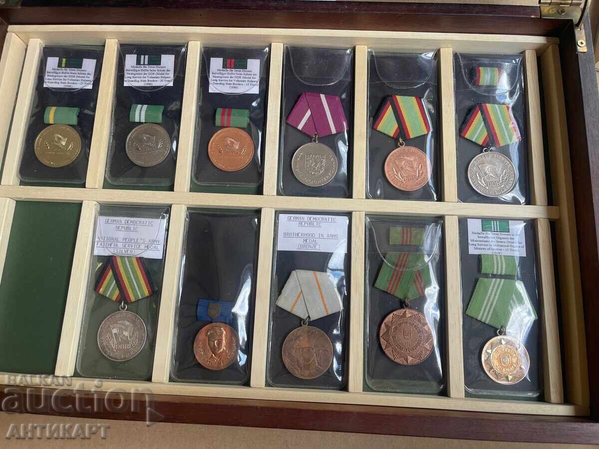Delivery of GDR Germany communism collector's box with 37 medals
