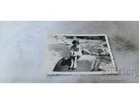 S-ka Sofia Young girl sitting on a rock by the river 1955