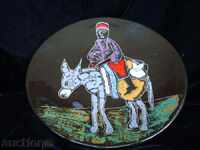 Decorative plate, pano-embossed, painted and colored.