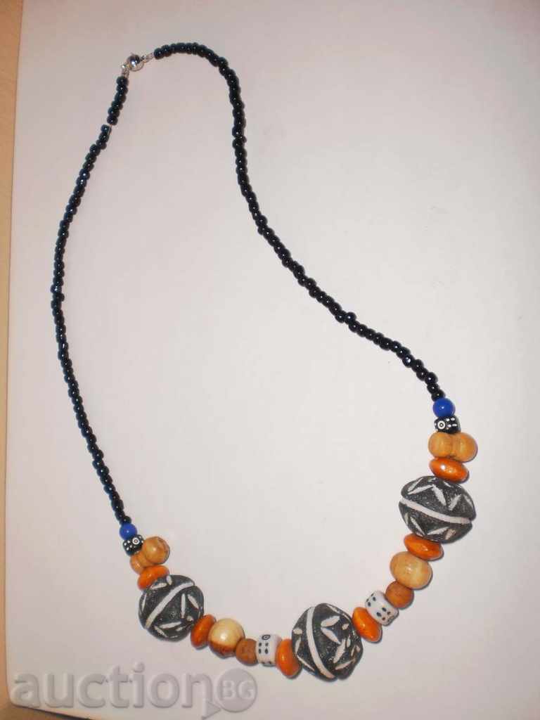 Auction Necklace with African motifs in grunge style-1 Auction Necklace with African motifs in grunge style-1