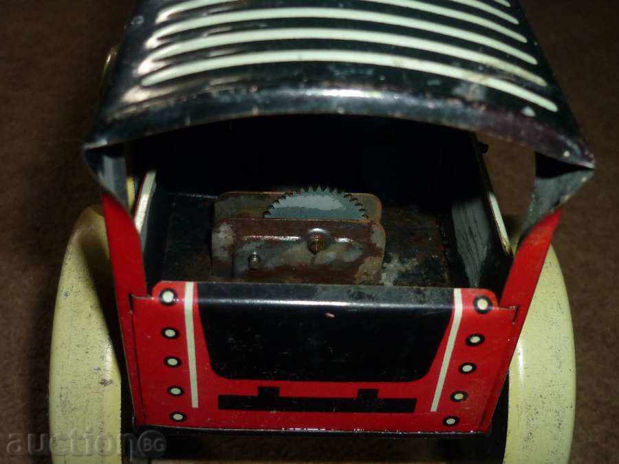Delivery of Vintage tin toy with winding mechanism Delivery of Vintage tin toy with winding mechanism