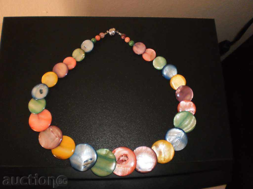 Auction Necklace made of natural multicolored mother of pearl in round shape Auction Necklace made of natural multicolored mother of pearl in round shape