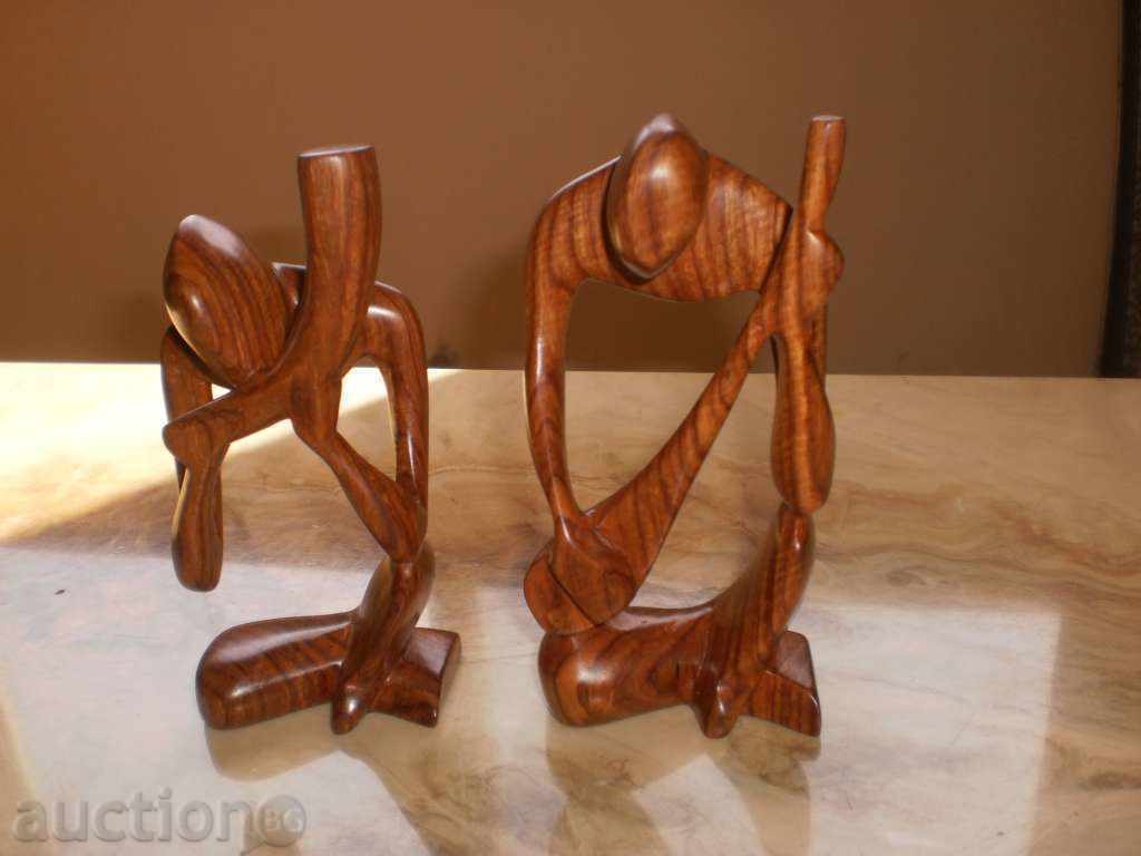 Auction A musician with a horn-stylized figure of the exotic wood Sessa Auction A musician with a horn-stylized figure of the exotic wood Sessa