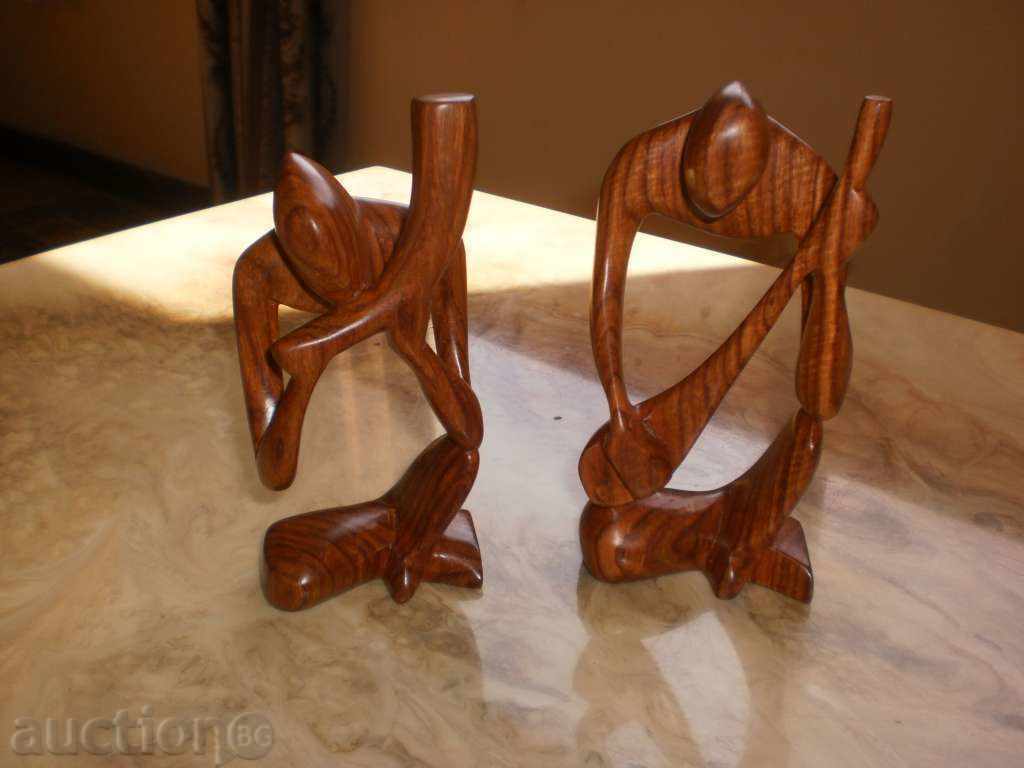 Delivery of A musician with a horn-stylized figure of the exotic wood Sessa Delivery of A musician with a horn-stylized figure of the exotic wood Sessa