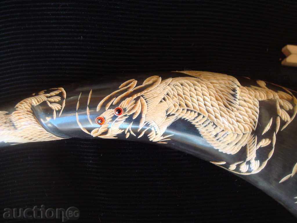 Auction Horn of buffalo, Threaded with a sore and a dragon on a tree. stand. Auction Horn of buffalo, Threaded with a sore and a dragon on a tree. stand.