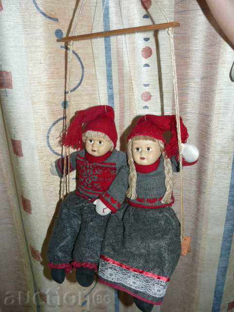 dolls on swing