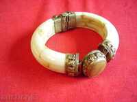 I sell a bracelet made of bone, metal casing and stone