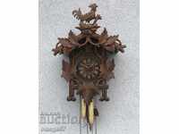 Wall clock with Black Forest cuckoo from 1900