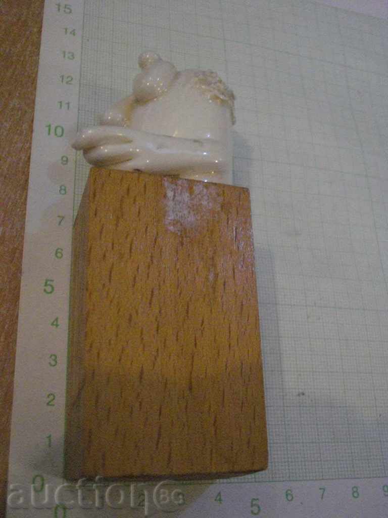 Auction Porcelain figure of a wooden pedestal Auction Porcelain figure of a wooden pedestal