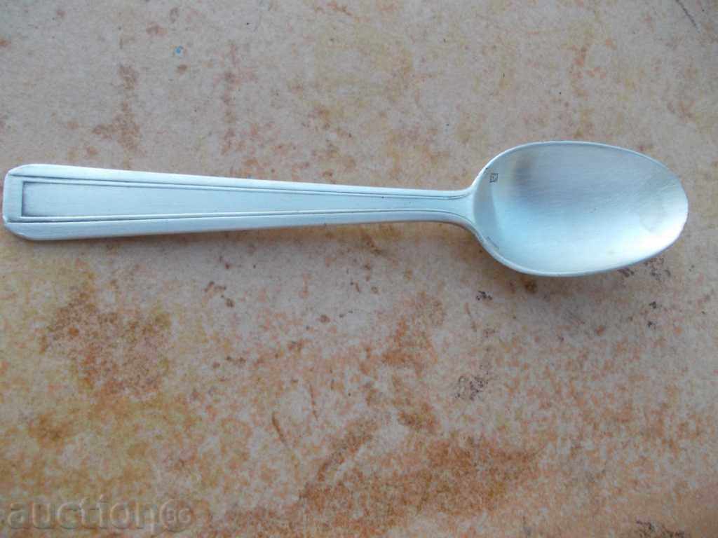 Thick silver spoon