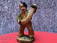 Αρχαίο κεραμικό ειδώλιο "Ο μικρός ακορντεονίστας"