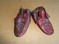 Old children's leather shoes, kaleurs, candy