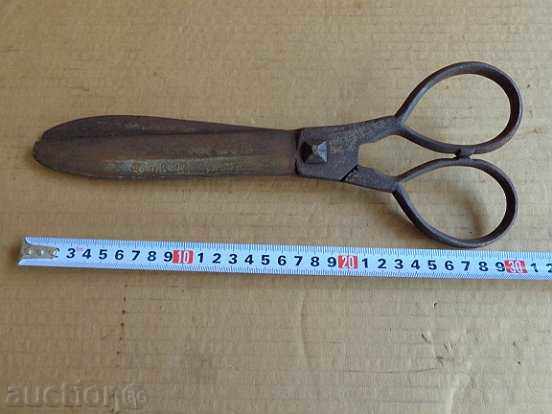 Old hand-forged abadge scissors