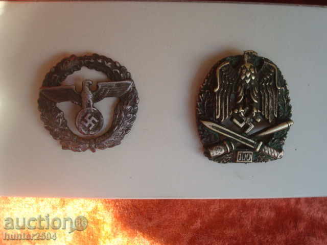 Military insignia swastika 100 battles and another with an eagle.