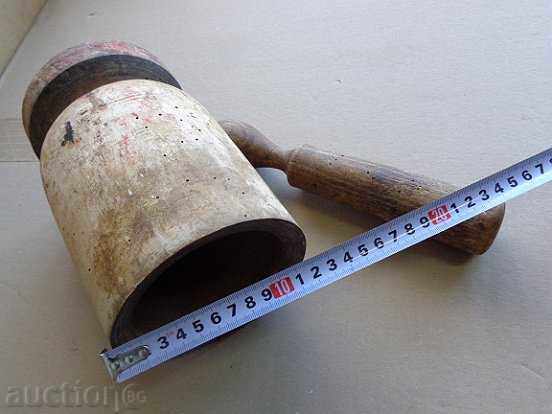 Delivery of An old wooden mortar with hammer, mortar, chiller, wooden Delivery of An old wooden mortar with hammer, mortar, chiller, wooden