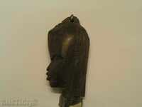 African amulet on a female head
