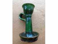 Old ceramic candlestick with green glen