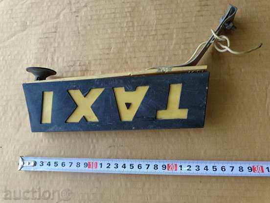 Delivery of An old plastic plaque of a co-op taxi Delivery of An old plastic plaque of a co-op taxi