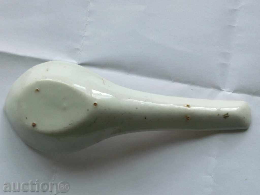 Auction An old ceramic spoon with gold Auction An old ceramic spoon with gold