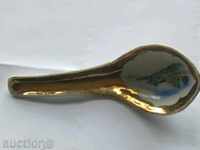 An old ceramic spoon with gold