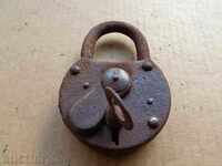 An old padlock, a catan, a coat, a latch, a lock