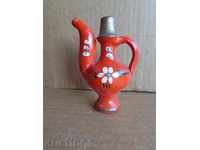 An old colorful stonemason, a pitcher, a little bit, a ceramics