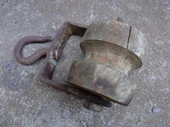 Old wooden reel, scraper, wrought iron Old wooden reel, scraper, wrought iron