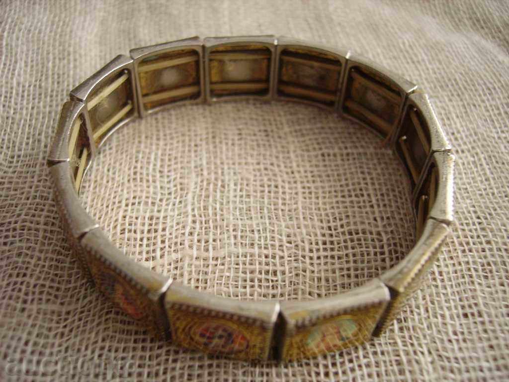 Auction Sell a metallic bracelet with religious motifs Auction Sell a metallic bracelet with religious motifs