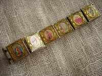 Sell ​​a metallic bracelet with religious motifs
