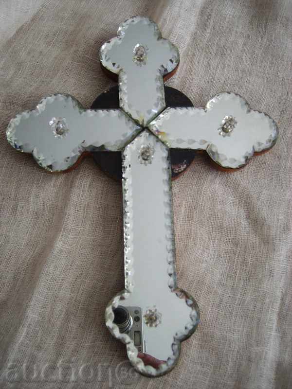 A large cross of wood and crystal mirror faceted glass