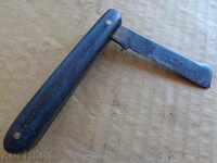 An old winegrowing knife with bakelite shakes with a mark
