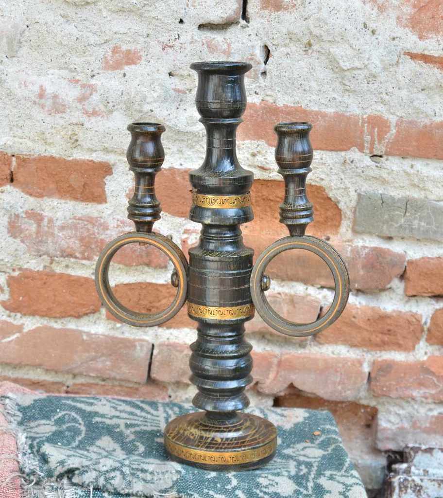 A triple wooden candle holder
