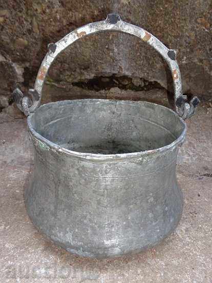 An old copper pot, a tin boiler, a baker, a spoon