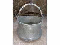 An old copper pot, a tin boiler, a baker, a spoon