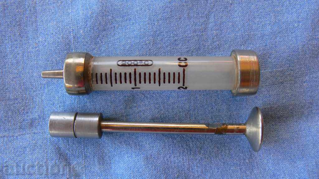 Auction  Syringe, glass injection made in Germany