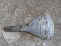 An old tin fuel funnel