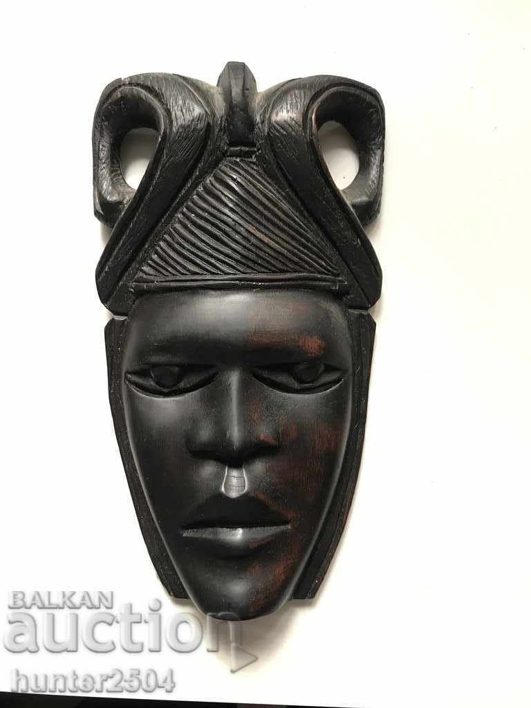Mask of an African woman, ebony, 22/12.5 cm