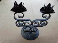 An old hand-forged candleholder, lamp, wrought iron, candle