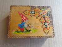 An old wooden pyrographic cigarette case, a box, a cigarette