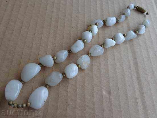 An old necklace made of semiprecious stones, a necklace, a jewel, a jewel
