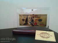 Gold 100 dollar banknote with a certificate