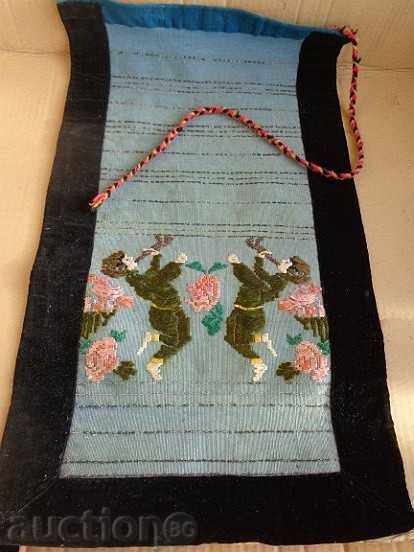 An old hand-woven apron with embroidery, costume