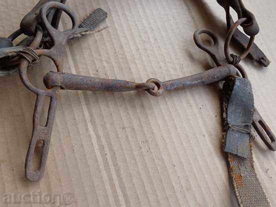 Auction A bridle with a strap, a wrought iron, a harness harness Auction A bridle with a strap, a wrought iron, a harness harness
