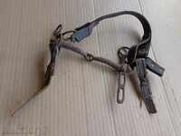 A bridle with a strap, a wrought iron, a harness harness