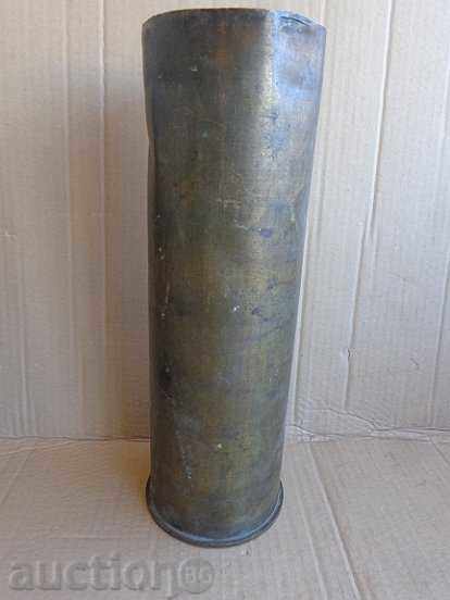 Old shell from a projectile, a vase, a cannon, a top
