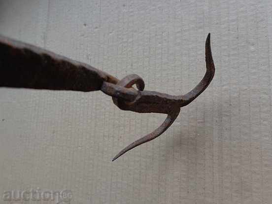 Delivery of An old forged hook for scraping, a cock, anchor Delivery of An old forged hook for scraping, a cock, anchor