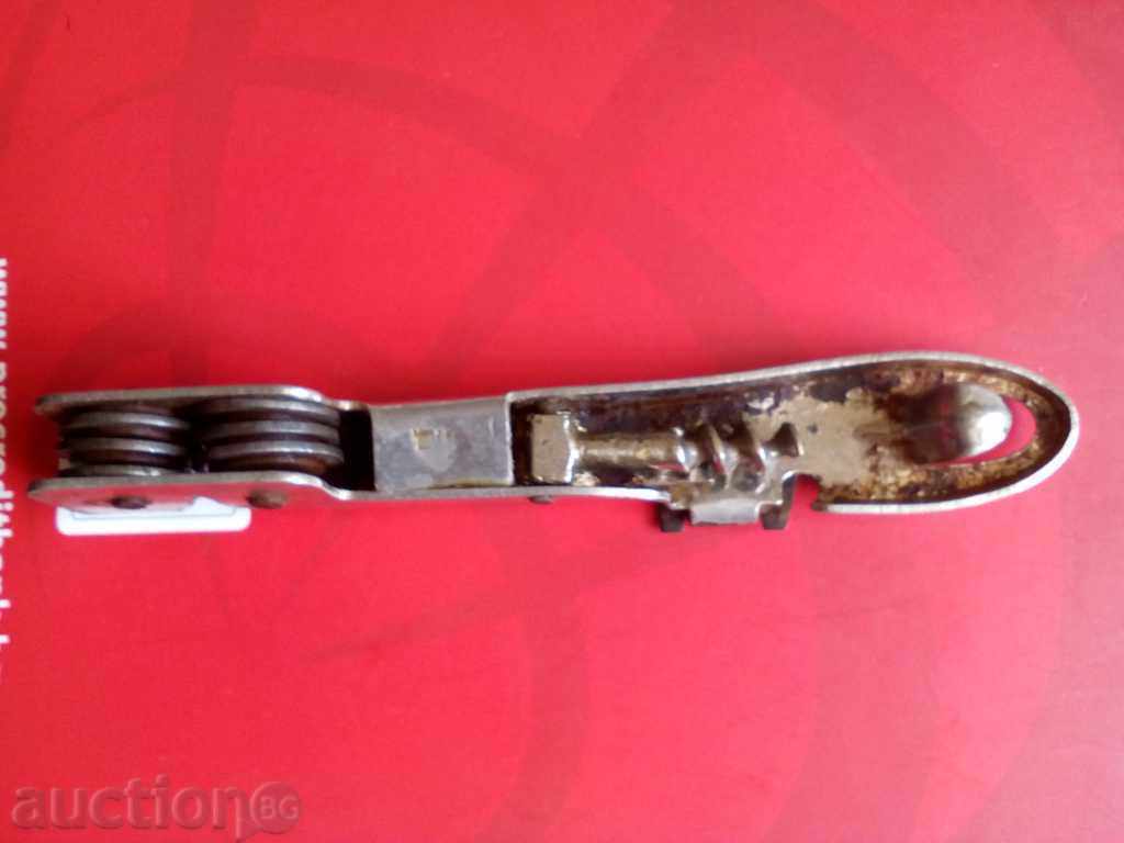 Auction  OLD UNIVERSAL OPENER WITH 4 FUNCTIONS