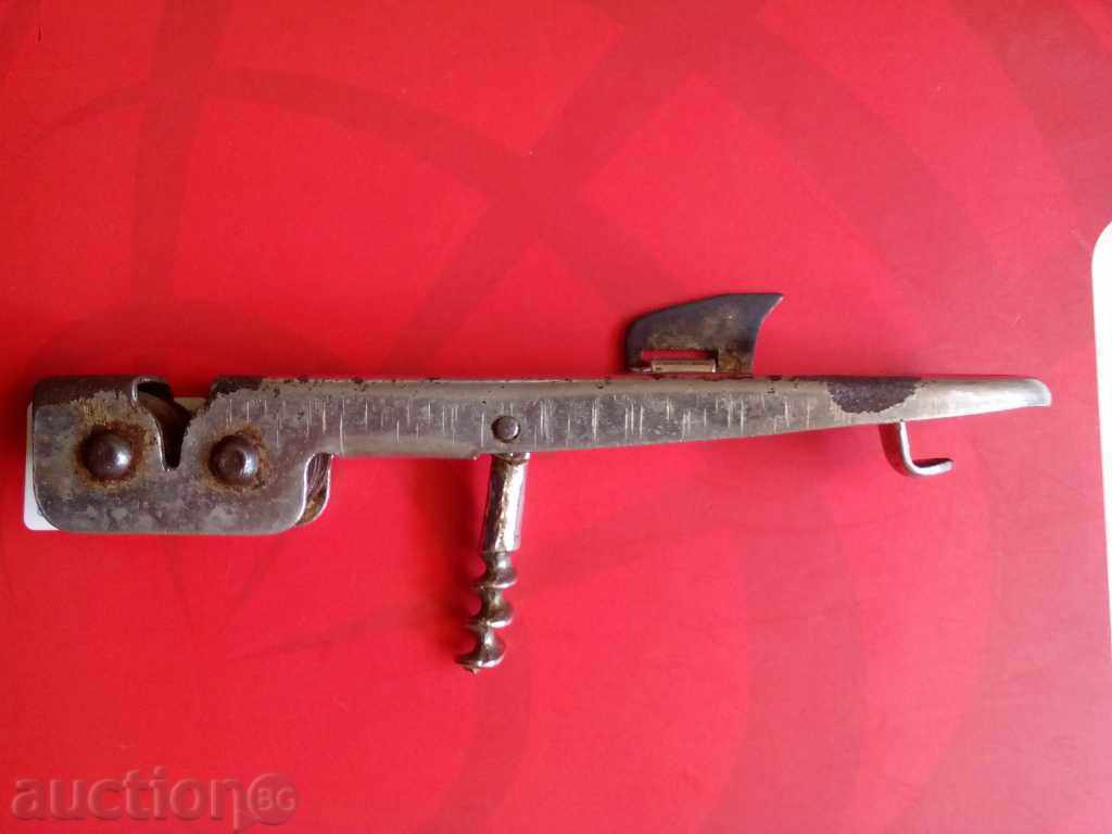 OLD UNIVERSAL OPENER WITH 4 FUNCTIONS